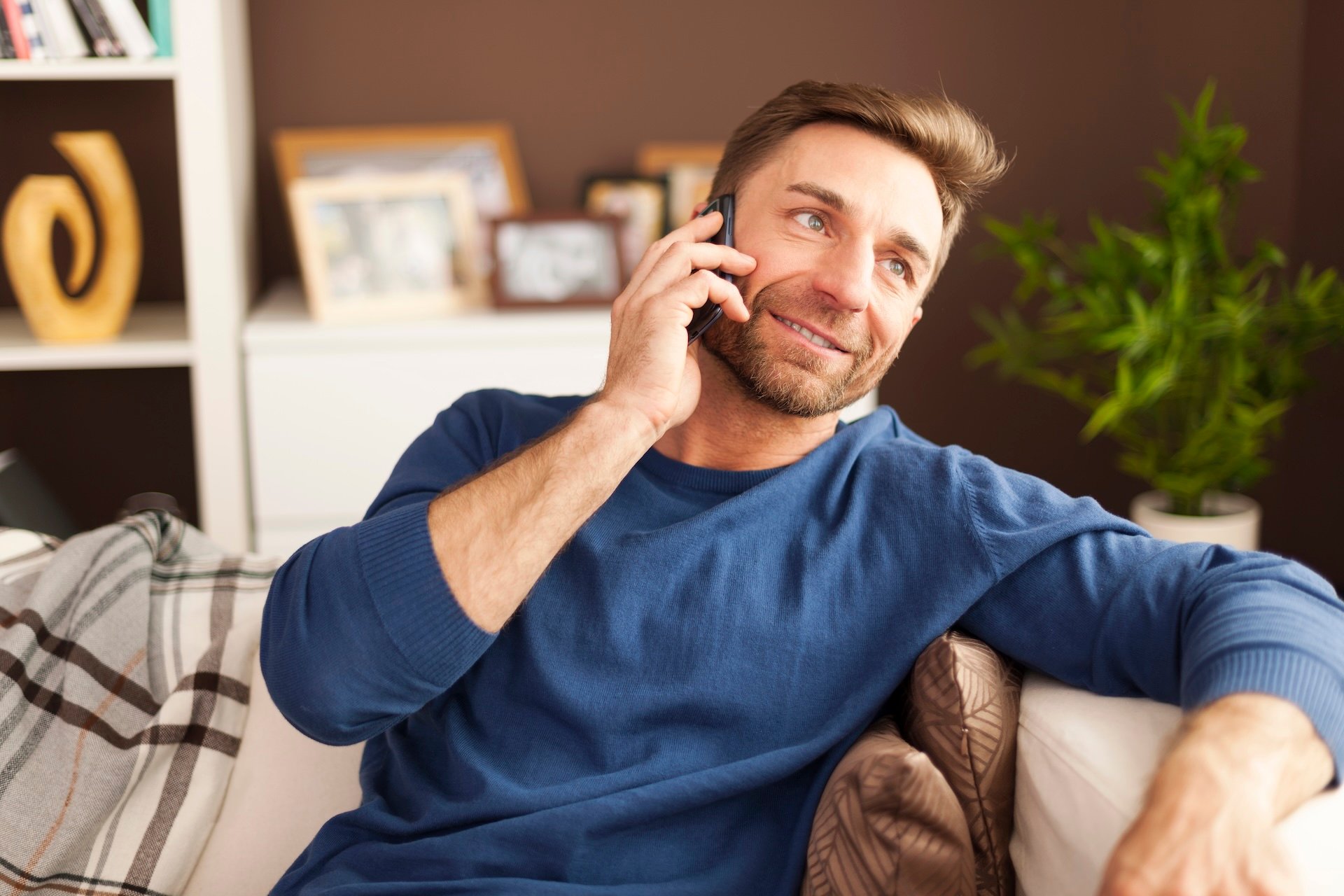 handsome-man-talking-mobile-phone-home-1 handsome-man-talking-mobile-phone-home-1